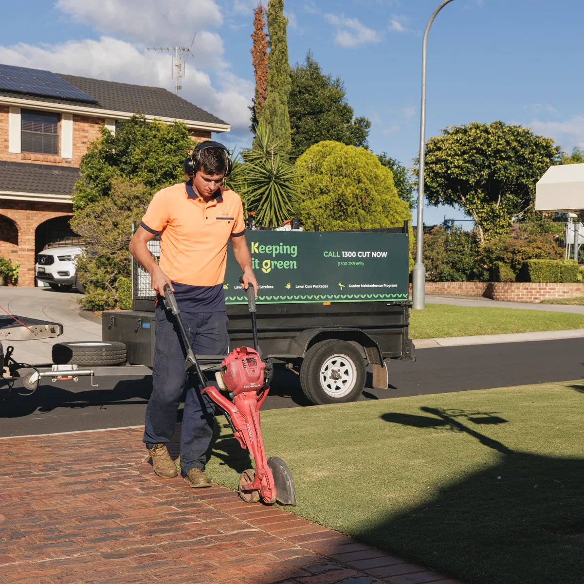 Restoring an overgrown lawn edge along a garden bed in Camden NSW