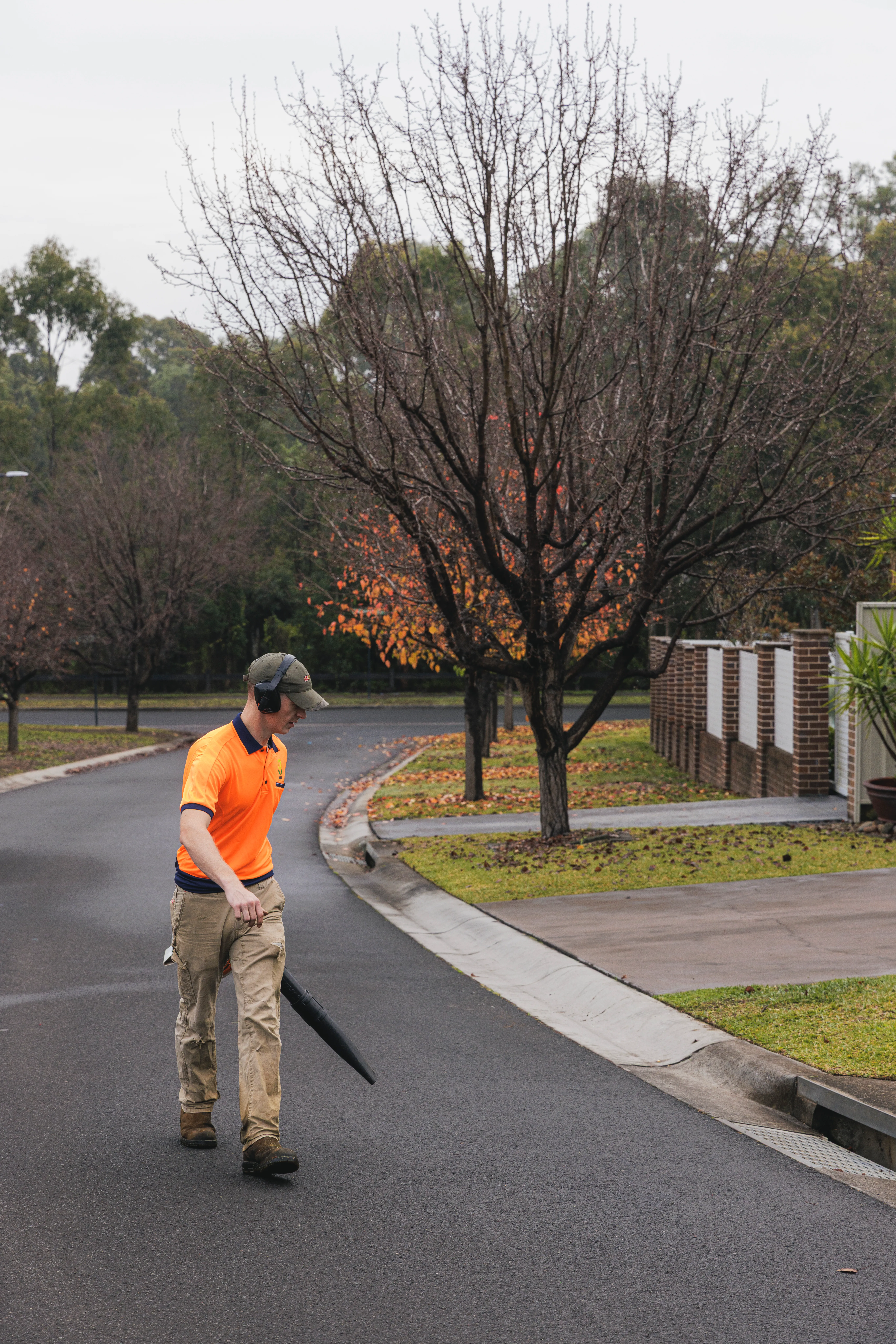 Blowing down a driveway for a tidy finish after an acreage mowing service