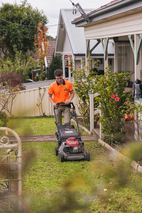 Keeping It Green team member mowing a lawn in Camden NSW