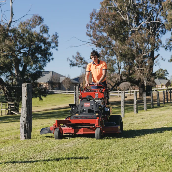Zero-turn ride-on mower finishing an acreage lawn near Camden NSW