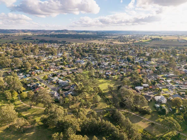 Aerial view of Camden South showing established homes, mature trees and surrounding farmland