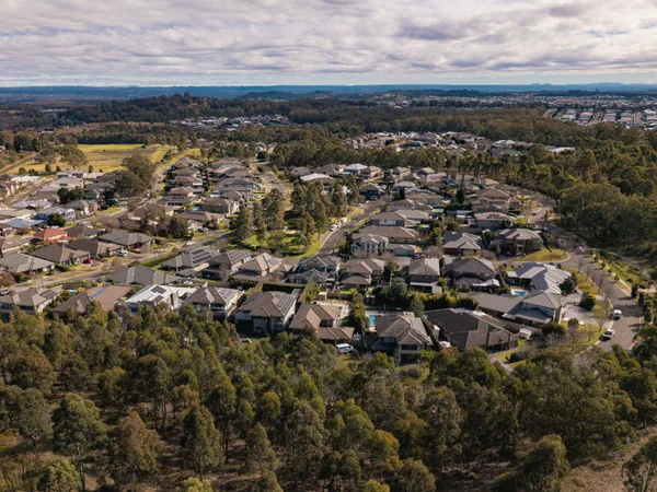 Aerial view of Harrington Park showing established homes, the lake and tree-lined streets