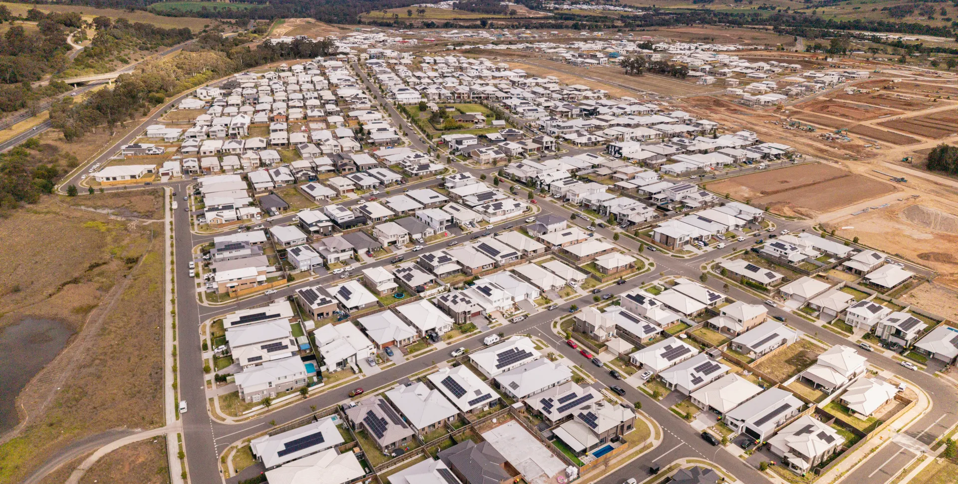 Aerial view of Menangle Park showing the new housing estate with rural land and bushland beyond