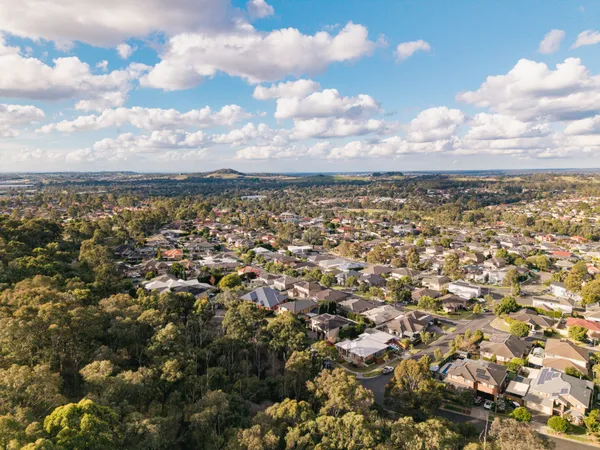 Aerial view of Mount Annan showing established homes bordering bushland reserve
