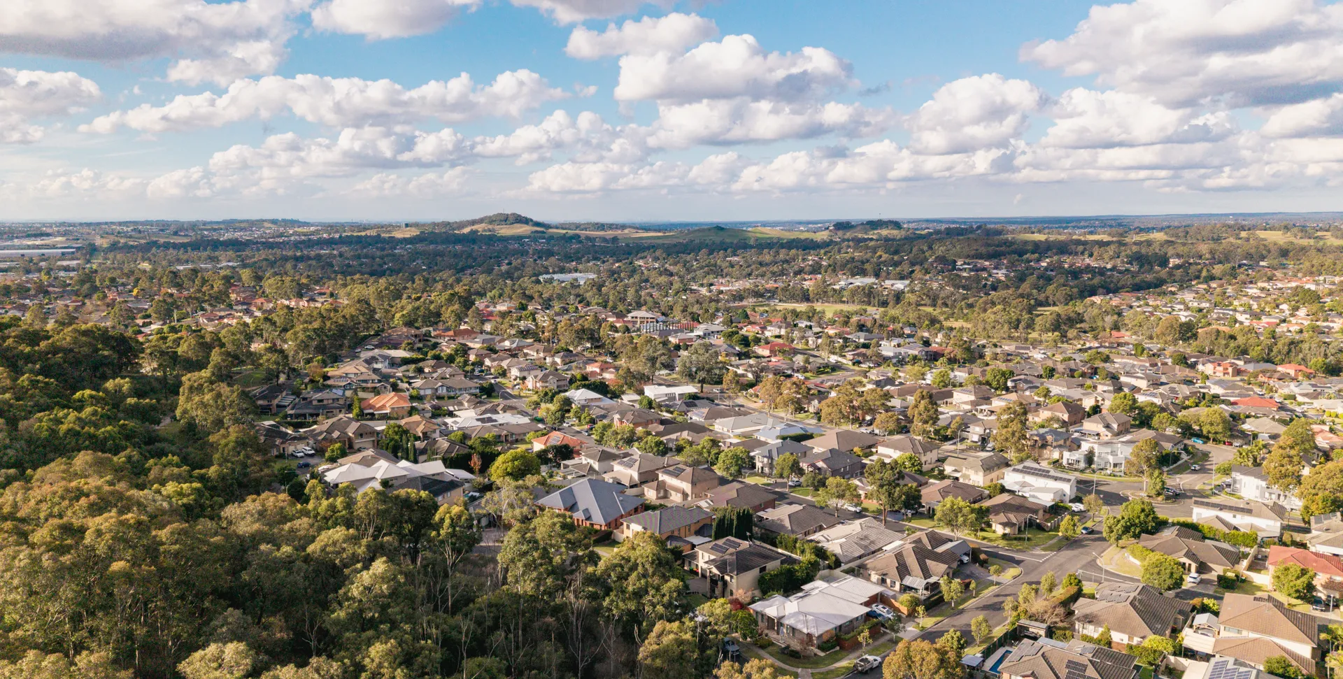 Aerial view of Mount Annan showing established homes bordering bushland reserve