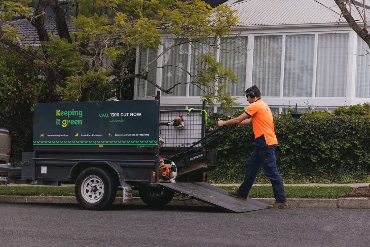 Lawn mower being pushed by a Keeping It Green team member in Camden NSW